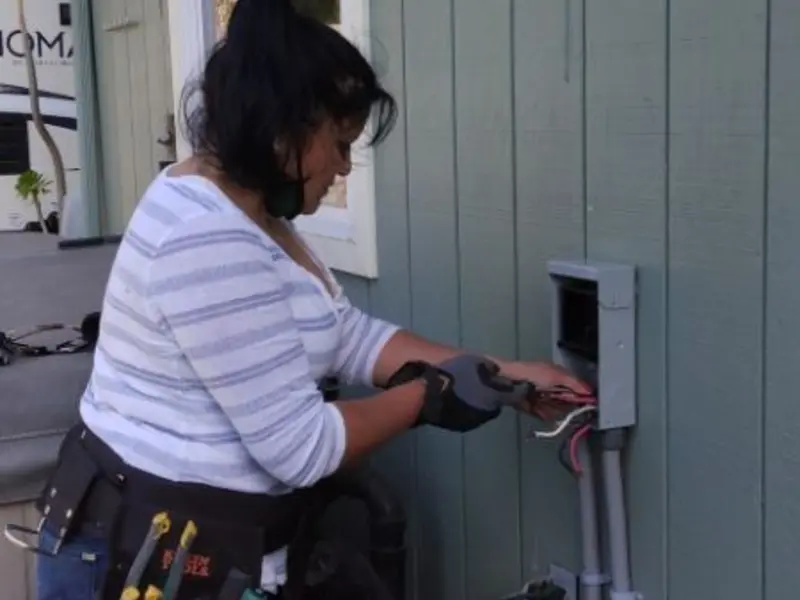 Licensed electrician wiring an exterior subpanel in Roseville